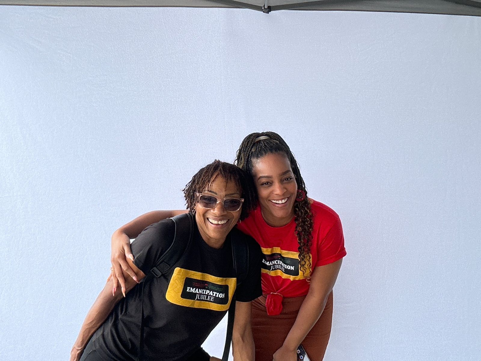 Two guests laughing together in a photo taken by the booth